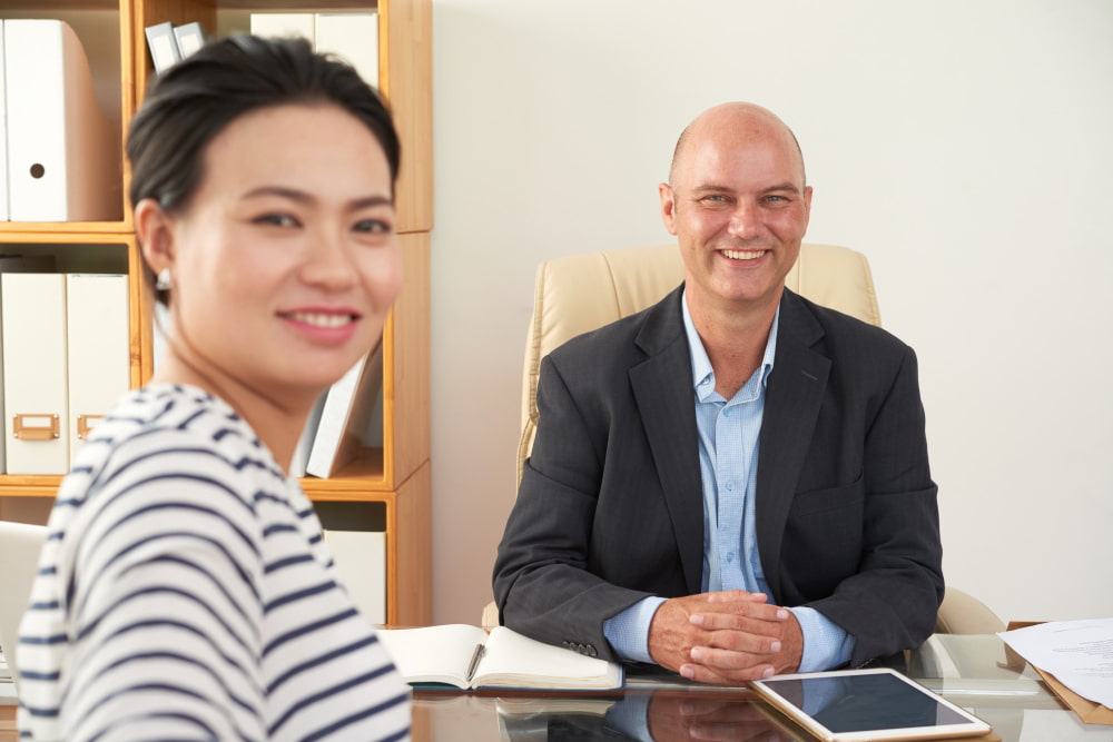 Employer and skilled worker discussing Australian employer sponsored visa pathways